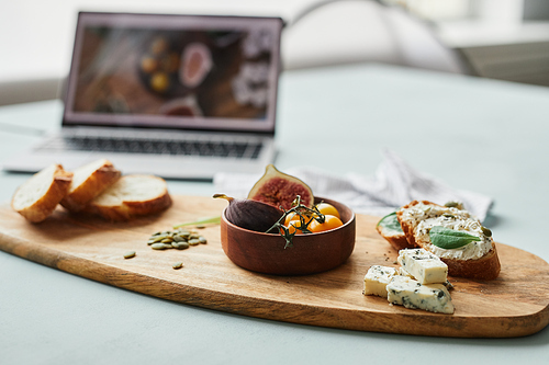 Close up of gourmet setup at food photographers studio with computer in background, copy space