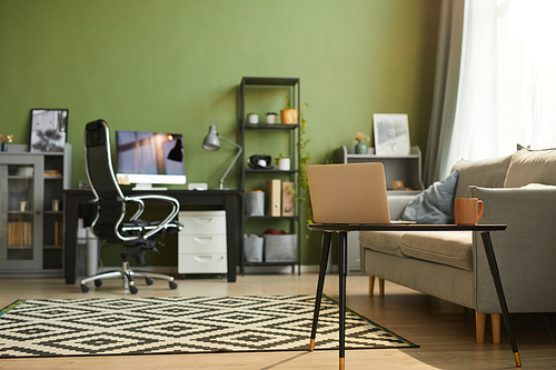 Background image of cozy home interior with sofa in foreground and home office workplace, copy space