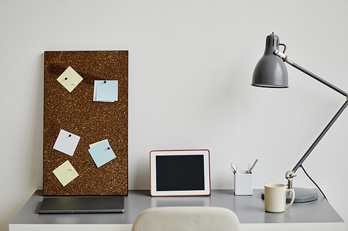 Minimal background image of white home office workplace with digital tablet on desk, copy space