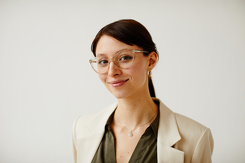 Minimal portrait of successful female entrepreneur on white smiling at camera