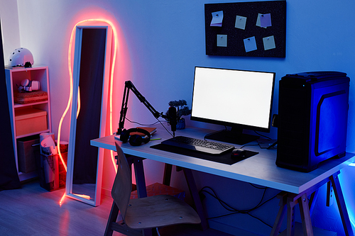 Background image of teenagers gaming room with blue neon lighting and PC screen mockup, copy space
