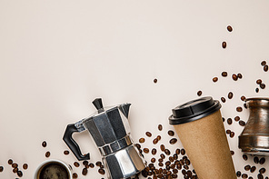 top view of cezve, coffee pot, paper cup and  coffee grains on beige background