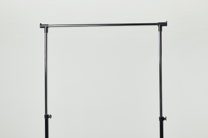 Black steel straight rack isolated on light grey