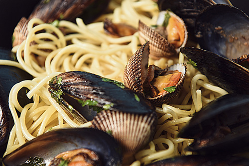 close up view of delicious Italian pasta with mollusks and mussels