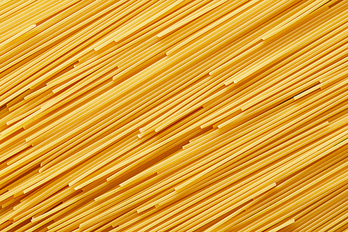 top view of raw spaghetti seamless background