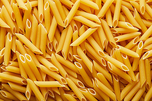 top view of raw penne seamless background pattern