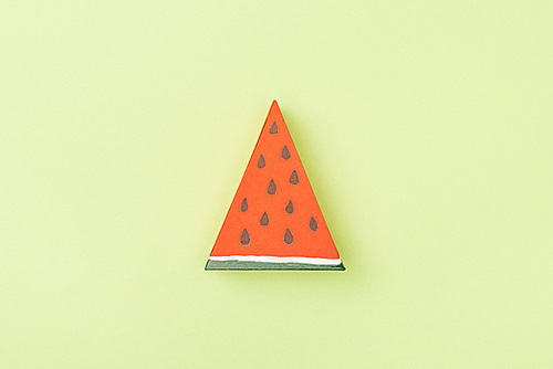 top view of handmade paper watermelon isolated on green