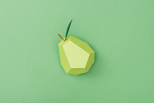 top view of handmade paper pear isolated on green
