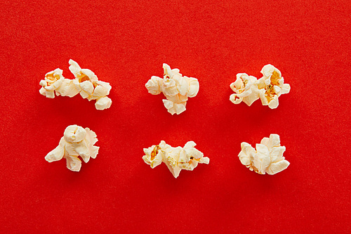 flat lay with sweet popcorn on red background