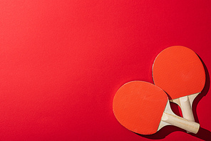 top view of table tennis rackets isolated on red
