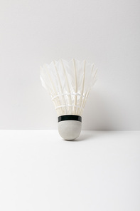 white badminton shuttlecock on white background with copy space