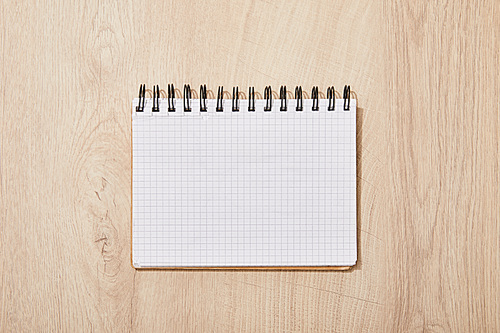 top view of empty blank notebook on wooden desk