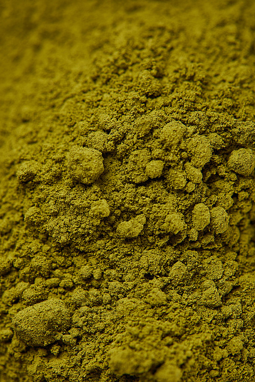 selective focus of dark green matcha powder
