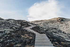 empty wooden walkway and snow at sunny day in iceland, Hraunfossar