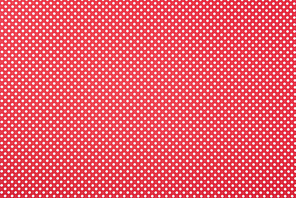 Texture of polka dot pattern on red background