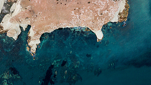 top view of rocky coast with blue water, Cyprus