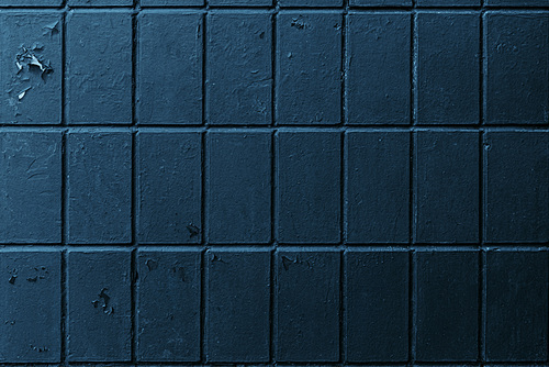 close-up view of old weathered dark brick wall background