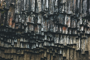 full frame image of black basalt column formation of Svartifoss in Iceland