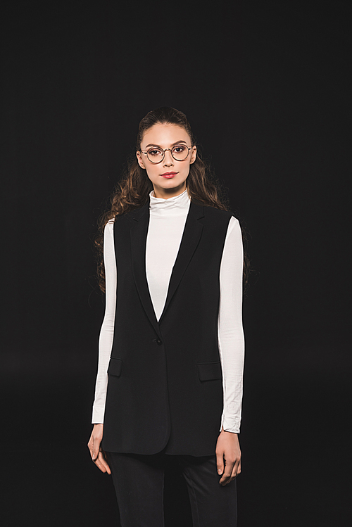 portrait of elegant stylish woman in eyeglasses  isolated on black