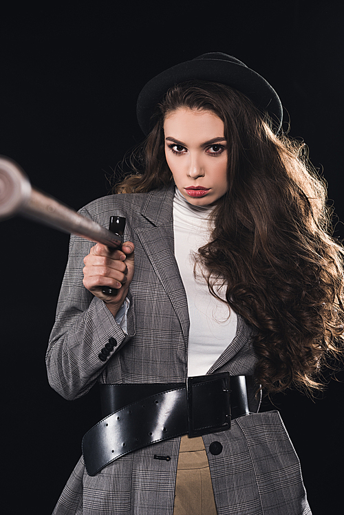 selective focus of stylish woman with walking stick  isolated on black