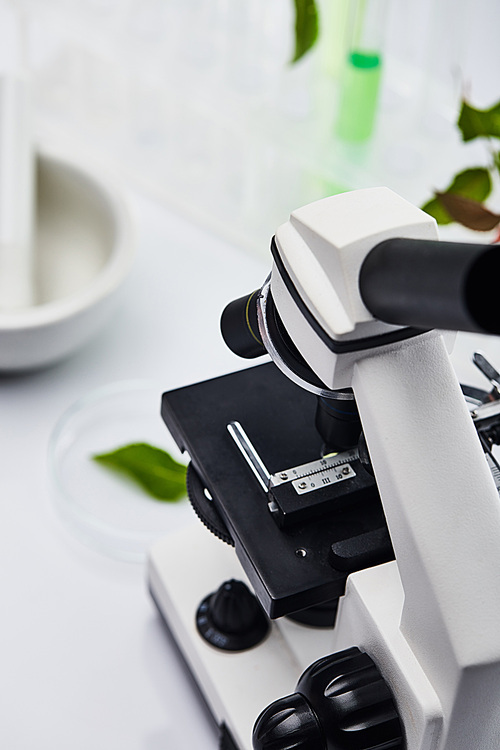 selective focus of microscope on white table in lab