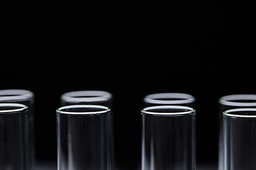 close up view of glass test tubes isolated on black