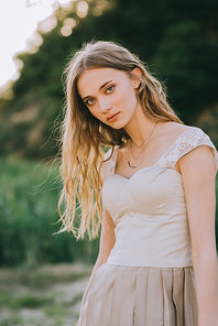 portrait of beautiful blonde girl in elegant trendy dress