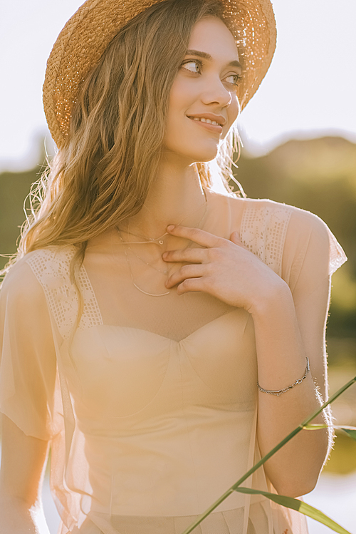 portrait of beautiful blonde girl in straw hat
