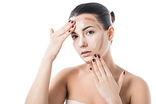 beautiful girl applying foundation cream on face and  isolated on white