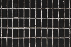 close-up view of rough black tiles background