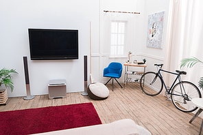 Interior of the living room with TV screen and sound speakers