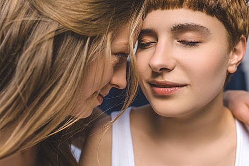 close-up hot of attractive cuddling lesbian couple