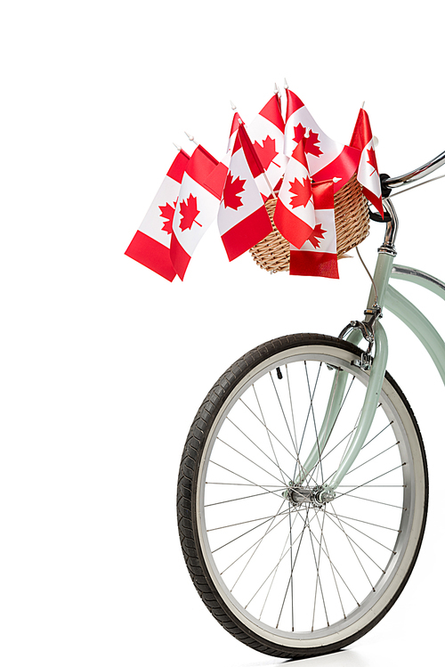 vintage bicycle with canadian flags isolated on white