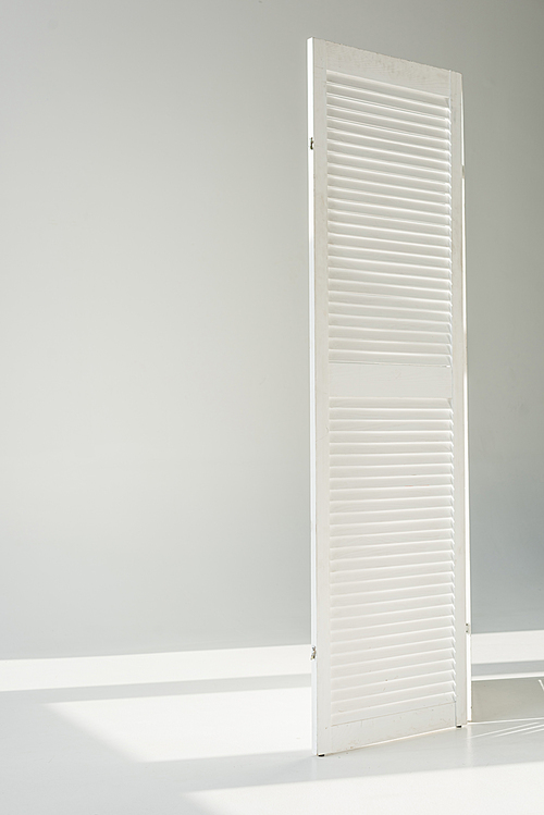 white textured door standing on grey background