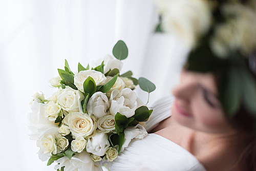 overhead view of elegant bride with white wedding bouquet