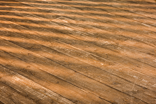 close up view of brown wooden floor as background