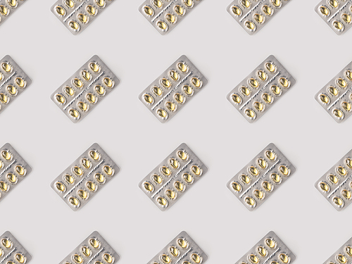 Set of blister packs with yellow pills isolated on white