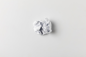 top view of crumpled paper on white surface