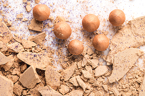 top view of crushed cosmetic powder on white tabletop