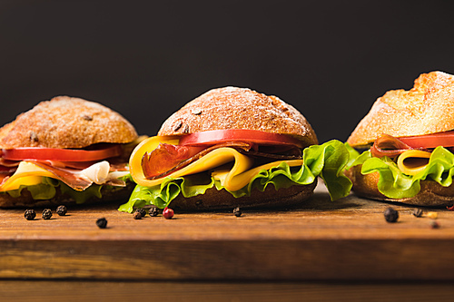 close up of sandwiches with cheese and vegetables