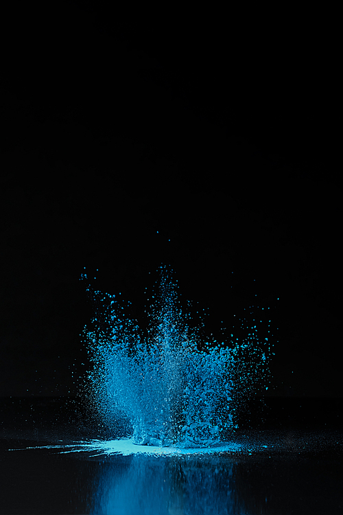 blue holi powder explosion on black, traditional Indian festival of colours