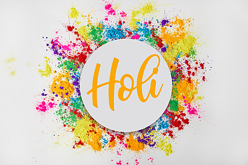 circle of colorful traditional powder with Holi sign, isolated on white, festival of colours