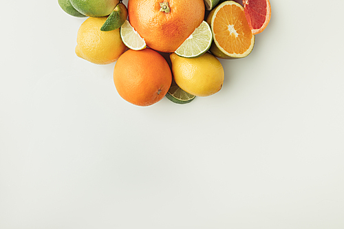 Pile of juicy citruses isolated on white