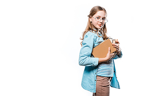 beautiful teenage girl in eyeglasses holding books and smiling at camera isolated on white