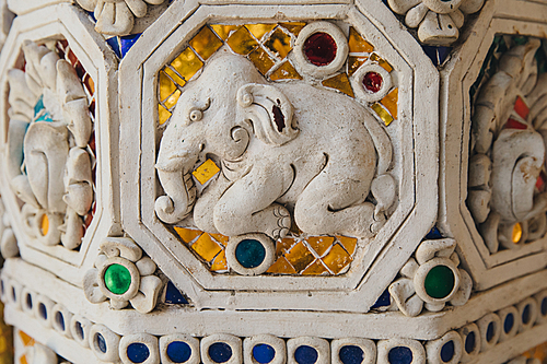 close-up view of decorative elephant on ancient architecture in Bangkok, Thailand