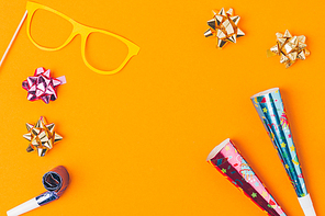 flat lay with various party objects and party mask isolated on orange