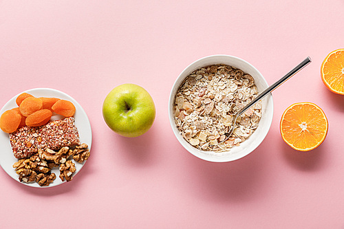 top view of fresh diet food on pink background with copy space