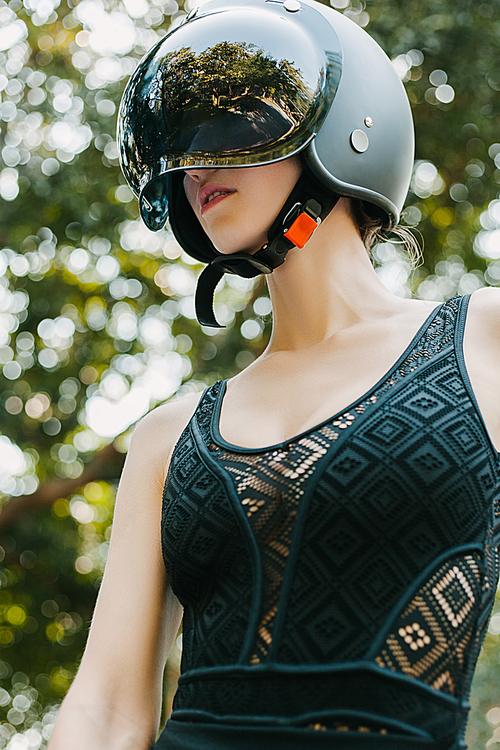 girl posing in black motorcycle helmet