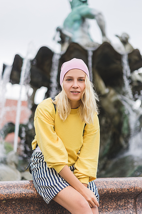 attractive woman  in front of Neptunbrunne in Berlin, Germany