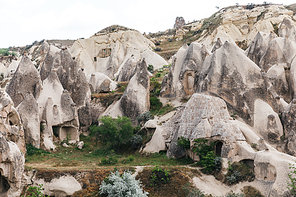 beautiful landscape with famous caves and rock formations in goreme national park, cappadocia, turkey
